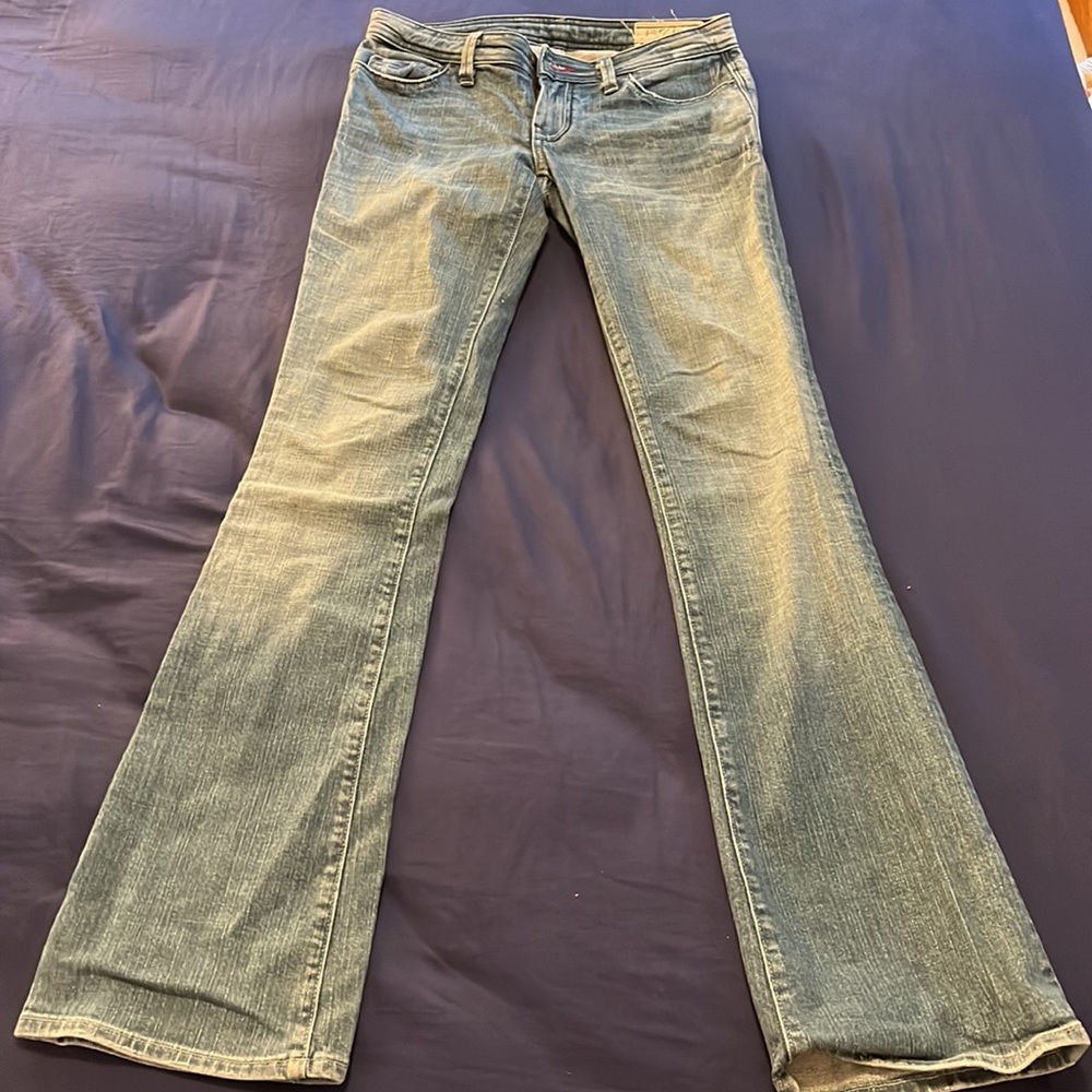 Distressed wide-legged flare jeans